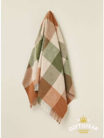 British Wool throw in a green and terracotta block check design. From Bronte by Moon. 